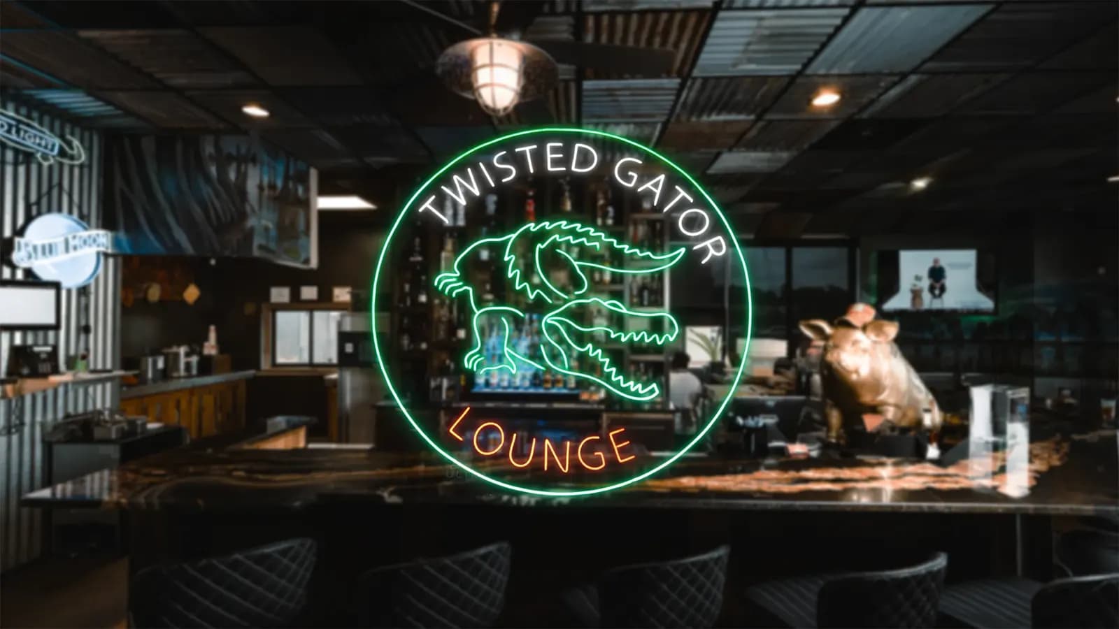 Twisted Gator Lounge neon sign glowing above the bar